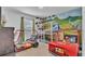 Bedroom with custom Jurassic Park themed bunkbeds and decor at 7012 Oakwood St, Davenport, FL 33837