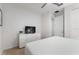 Comfortable bedroom featuring a large bed, dresser with television, and closet at 7012 Oakwood St, Davenport, FL 33837