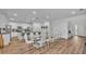Spacious dining area with a large glass table and ample seating for large gatherings at 7012 Oakwood St, Davenport, FL 33837