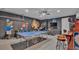 Spacious game room with arcade games, ping pong table and cartoon character decorations at 7012 Oakwood St, Davenport, FL 33837