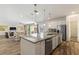 Spacious kitchen seamlessly flows into the dining and living areas, perfect for entertaining at 7012 Oakwood St, Davenport, FL 33837