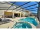 Private screened-in pool and spa area, perfect for relaxation and outdoor entertaining at 7012 Oakwood St, Davenport, FL 33837