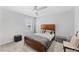 Neutral bedroom with wood furnishings, carpet, and modern ceiling fan for a relaxing atmosphere at 7633 Agrigento St, Clermont, FL 34714