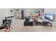 Bonus room with sitting area, workout equipment, and shelving at 7633 Agrigento St, Clermont, FL 34714