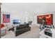 Large bonus room with TV, seating, gym equipment, and natural light at 7633 Agrigento St, Clermont, FL 34714