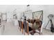 Dining room with kitchen and oversized angel artwork at 7633 Agrigento St, Clermont, FL 34714