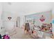 Playroom featuring a large window for natural light and carpet flooring throughout at 7633 Agrigento St, Clermont, FL 34714