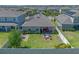 Aerial view of a fenced backyard with a fire pit and seating area on a sunny day at 861 Grazie Loop, Davenport, FL 33837