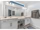 Bright bathroom with double sinks, granite countertops, and a makeup vanity at 861 Grazie Loop, Davenport, FL 33837