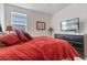 Bedroom featuring a queen bed, nightstands, lamps, and a television at 861 Grazie Loop, Davenport, FL 33837