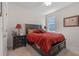 Bedroom featuring a queen bed, nightstands, and lamps at 861 Grazie Loop, Davenport, FL 33837