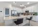 Modern kitchen with white cabinets, stainless steel appliances, mosaic backsplash, quartz countertops, and pendant lighting at 861 Grazie Loop, Davenport, FL 33837