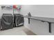 Laundry room featuring a foldable ironing board and appliances at 861 Grazie Loop, Davenport, FL 33837