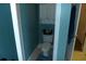 Charming half bathroom with convenient built-in storage shelves and toilet at 908 Hilly Bend Dr, Apopka, FL 32712