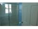 Bathroom featuring a glass-enclosed shower, tile surround, and convenient towel rack at 908 Hilly Bend Dr, Apopka, FL 32712