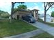 View of house with landscaping, driveway, truck, and a well manicured front lawn at 908 Hilly Bend Dr, Apopka, FL 32712