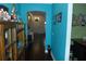 Hallway view showing hardwood flooring, archway, and neutral-toned walls connecting living spaces at 908 Hilly Bend Dr, Apopka, FL 32712