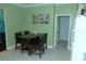 Eat-in kitchen area with a dark wood table, seating for four, and a view into the kitchen at 908 Hilly Bend Dr, Apopka, FL 32712