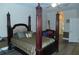 Spacious main bedroom with a four-poster bed and a ceiling fan at 908 Hilly Bend Dr, Apopka, FL 32712