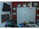 Home office features framed awards, a flat screen TV, and organized storage at 908 Hilly Bend Dr, Apopka, FL 32712
