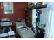 Office with framed awards, comfy chair, and organized shelving for storage at 908 Hilly Bend Dr, Apopka, FL 32712