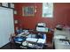 Cozy home office boasts framed pictures, trophies, and an organized workspace at 908 Hilly Bend Dr, Apopka, FL 32712