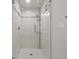 Bathroom featuring walk-in shower with decorative tile surround and mosaic accents at 9385 Lake Lotta Cir, Gotha, FL 34734