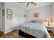 Bedroom features wood floors, ceiling fan, closet and colorful decor at 9385 Lake Lotta Cir, Gotha, FL 34734