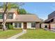 Inviting single-story home showcasing a manicured lawn, pathway, and neat landscaping leading to a cozy entrance at 9385 Lake Lotta Cir, Gotha, FL 34734