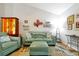 Cozy living room with comfortable furniture, decorative accents, and ample lighting, creating a warm and inviting space at 9385 Lake Lotta Cir, Gotha, FL 34734