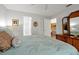 Comfortable main bedroom with ceiling fan, closet, and ensuite bathroom for a relaxing retreat at 9385 Lake Lotta Cir, Gotha, FL 34734