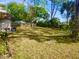 A spacious backyard with lush green grass and mature trees at 1011 Beulah Dr, Edgewater, FL 32132