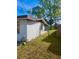 Fenced backyard featuring a grassy yard and gated access at 1011 Beulah Dr, Edgewater, FL 32132