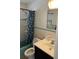 Bathroom featuring a blue shower curtain and vanity sink at 1011 Beulah Dr, Edgewater, FL 32132