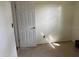Bedroom with a door, outlet and tan carpeting at 1011 Beulah Dr, Edgewater, FL 32132