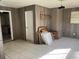Bonus room with tile floors, drop ceiling and wood paneling at 1011 Beulah Dr, Edgewater, FL 32132