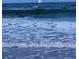 A scenic ocean view with waves and a boat far away at 1011 Beulah Dr, Edgewater, FL 32132