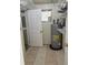 Pantry area with shelving, tile flooring, and a water heater at 1011 Beulah Dr, Edgewater, FL 32132
