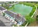 Aerial view of townhomes next to a lake at 1011 Cedar Bay Ln, Winter Springs, FL 32708