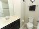 Bathroom featuring a vanity with dark wood cabinets and a neutral countertop at 1011 Cedar Bay Ln, Winter Springs, FL 32708
