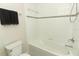 Well-lit bathroom featuring a shower-tub combination with tiled walls and modern fixtures at 1011 Cedar Bay Ln, Winter Springs, FL 32708