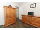 Bedroom with wooden furniture, wood-look floors, and ample storage at 1011 Cedar Bay Ln, Winter Springs, FL 32708