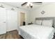 Comfortable bedroom featuring a padded headboard, matching nightstand, and a double door closet at 1011 Cedar Bay Ln, Winter Springs, FL 32708