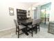 Dining area with an elegant table, stylish chairs, and a bar area at 1011 Cedar Bay Ln, Winter Springs, FL 32708