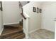 Home entryway with wood stairs and tiled floors, offering a welcoming entrance to the home at 1011 Cedar Bay Ln, Winter Springs, FL 32708