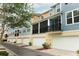 Street view showcasing the exteriors of multiple townhomes with garages and patios at 1011 Cedar Bay Ln, Winter Springs, FL 32708