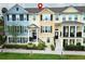 Charming townhouses featuring colorful exteriors, black shutters, and manicured landscaping for curb appeal at 1011 Cedar Bay Ln, Winter Springs, FL 32708