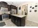 Charming kitchen with stainless steel appliances, a center island, and tiled floors at 1011 Cedar Bay Ln, Winter Springs, FL 32708
