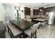 Lovely open-concept kitchen area with a dining table, granite counters, and stainless steel appliances at 1011 Cedar Bay Ln, Winter Springs, FL 32708