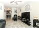 Spacious living room with tile flooring, comfortable seating, and stylish decor for modern living at 1011 Cedar Bay Ln, Winter Springs, FL 32708
